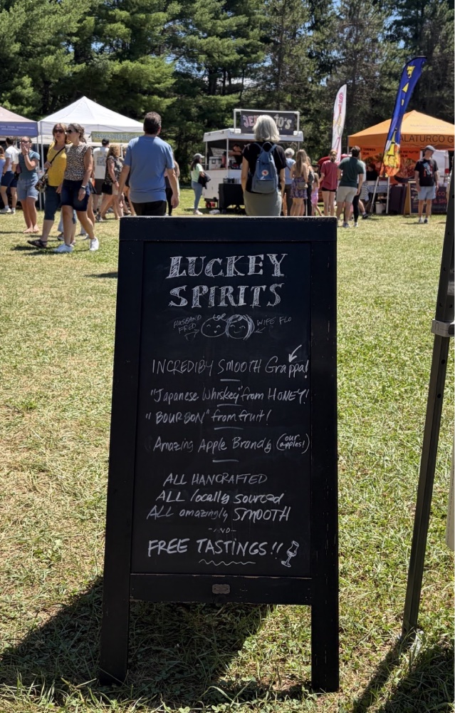Luckey Spirits chalkboard sign advertising free tastings