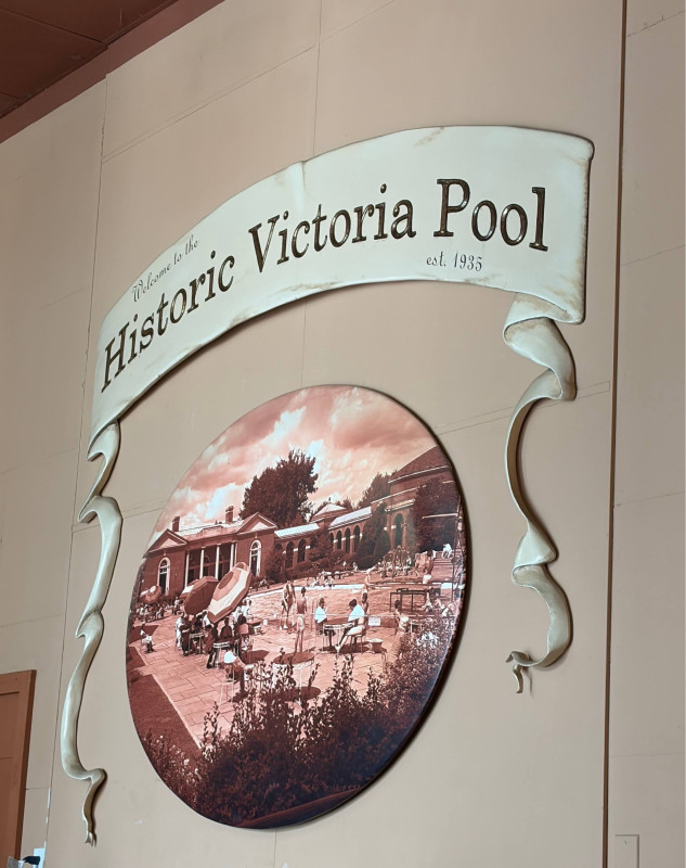 Welcome to the Historic Victoria Pool Sign with old photo of the grounds.